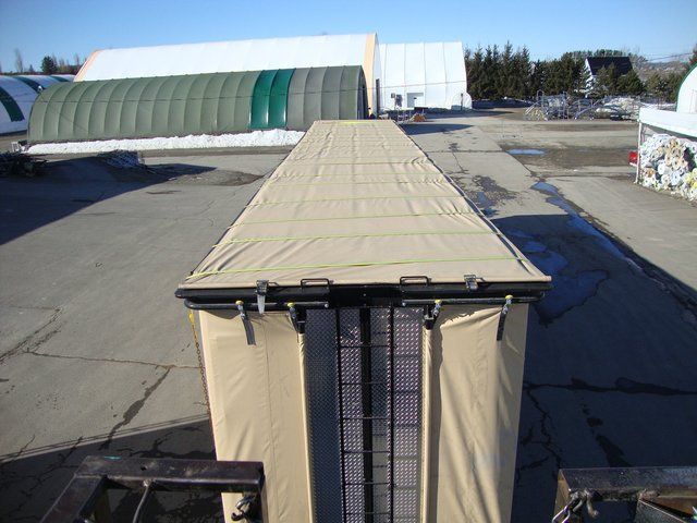 Cover-Tech Inc. flatbed tarps Rolling side curtains on a chicken trailer