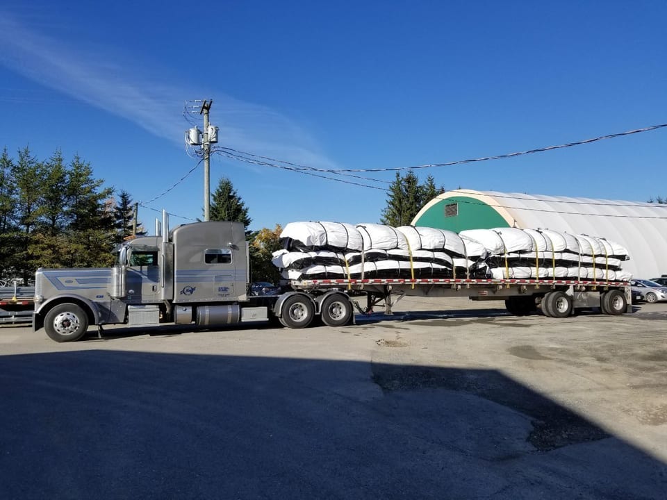 Cover-Tech Inc. custom made  insulated tarps being used to cure concrete for Muskrat Falls.