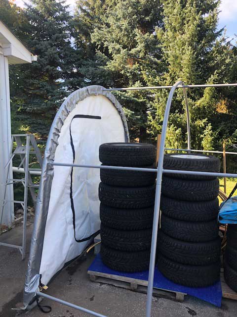 A bunch of tires are stacked on top of each other