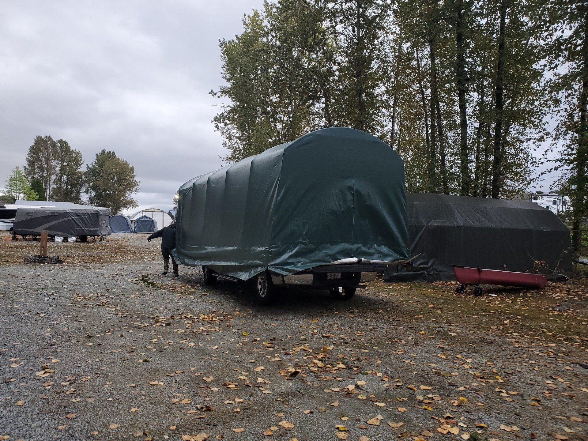 cover-tech reviews pic showing portable car shelter being moved