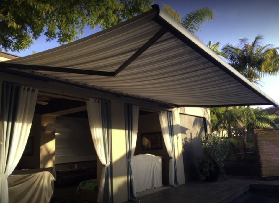 A patio with a large awning over it