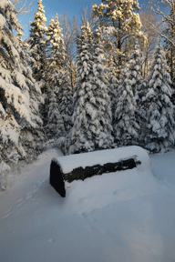 cover-tech reviews pic showing portable boat shelter in snow storm
