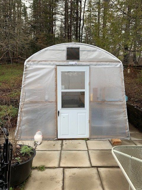 get extra ventilation on your portable greenhouse shelter with a screen door 