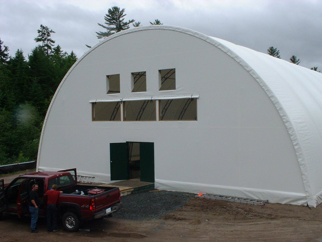DOME BUILDINGS fabric buildings 55' x 150' covering salmon tanks