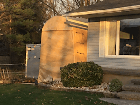 A house with a shed in front of it