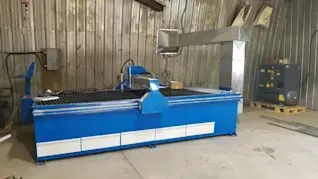 A blue and white machine is sitting in a room.