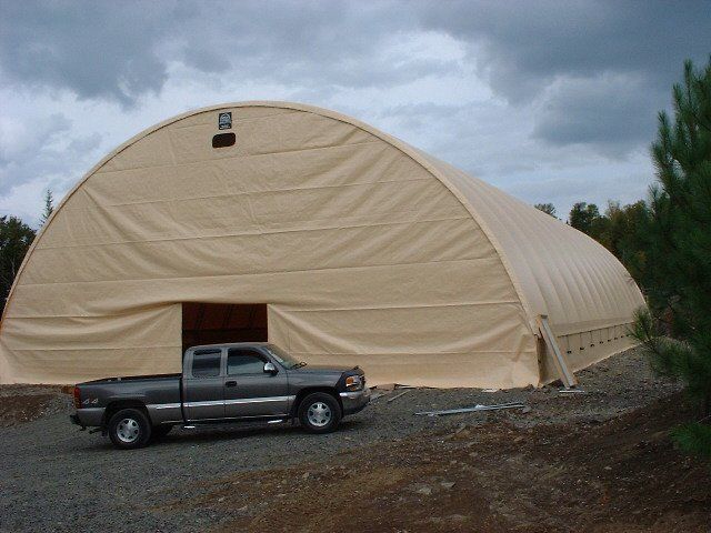 cover-tech inc.  Replacing a cover on a 60' x 150' building. Main cover is secured and tight, end walls are now being installed