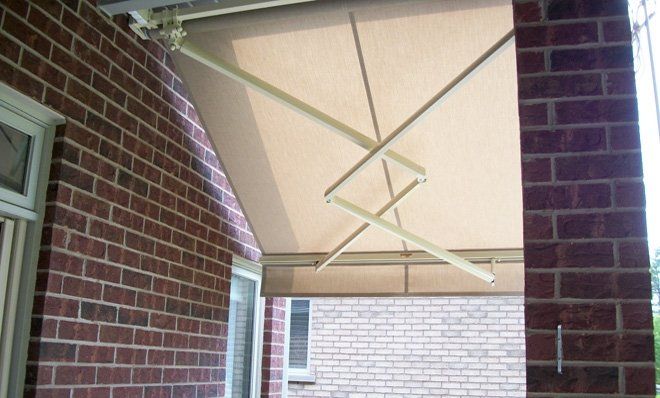A brick building with a white awning over it