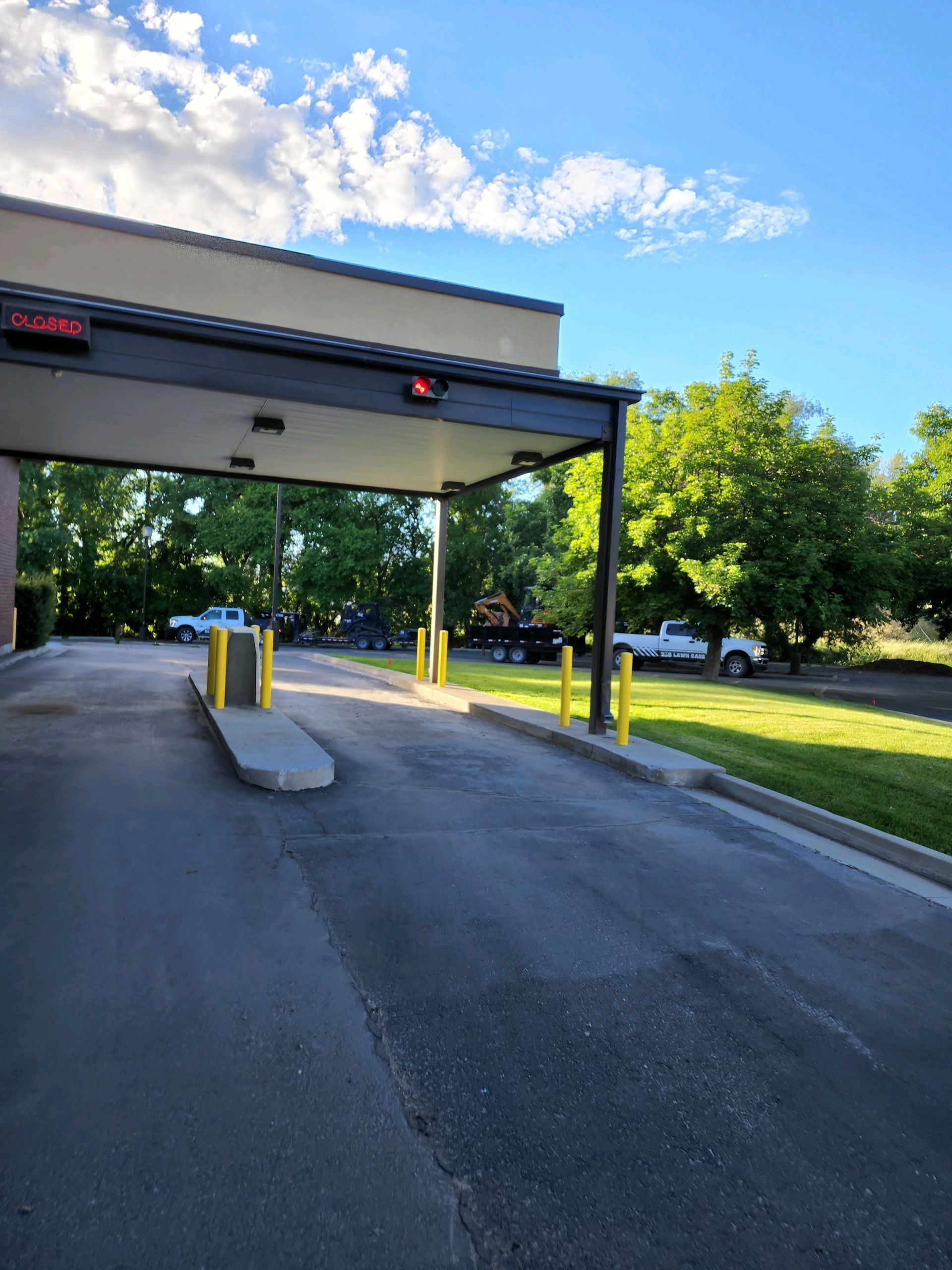 A Parking Lot with Cars Parked in Front of A Building