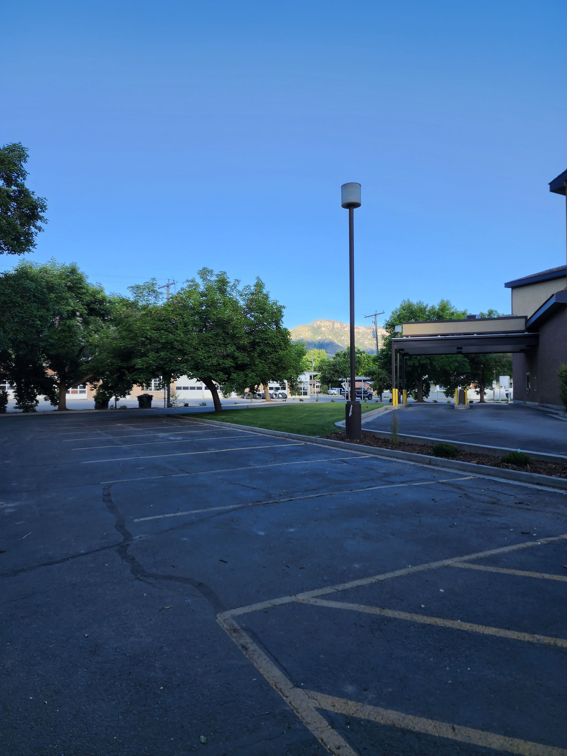 A Parking Lot with A Mountain in The Background