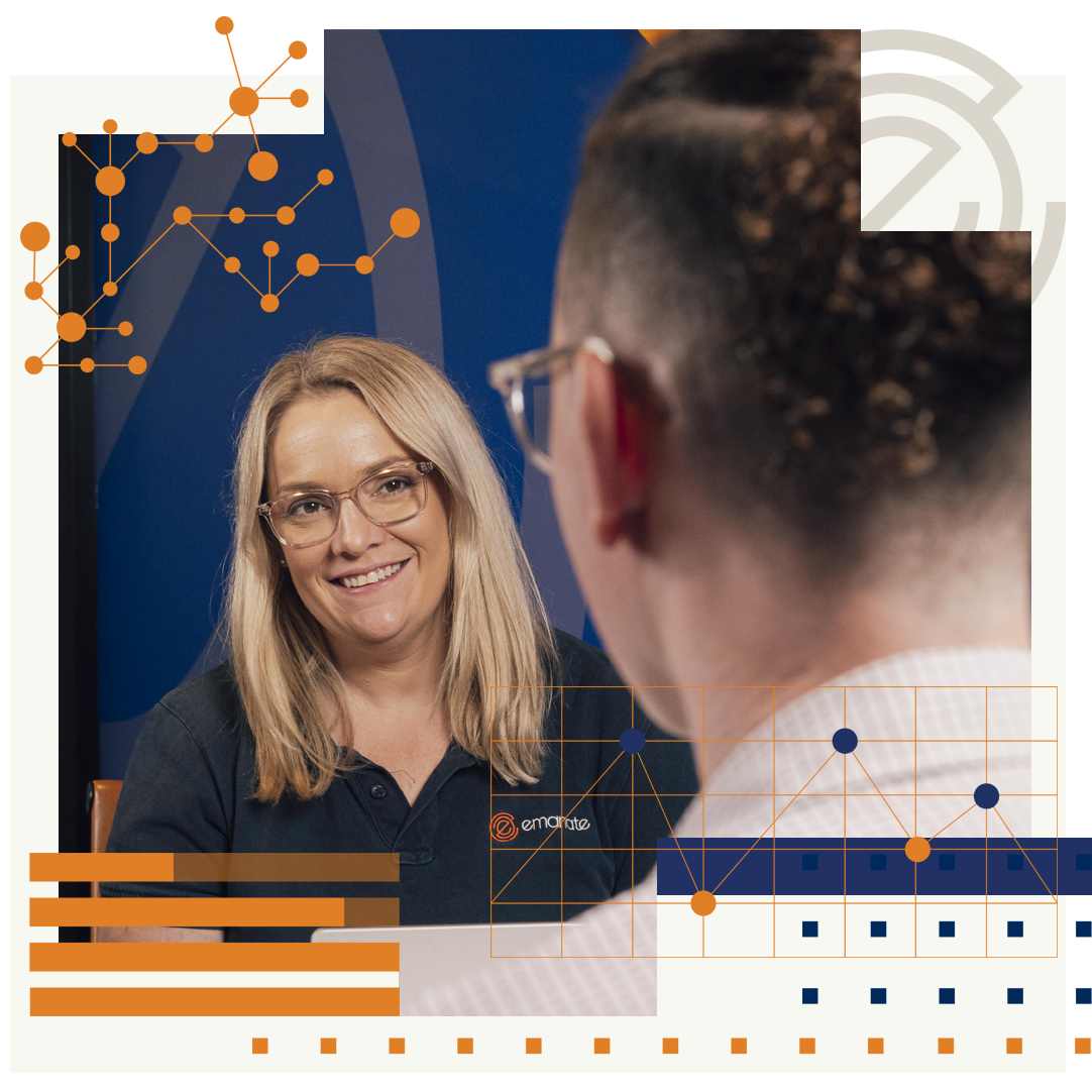 A woman wearing glasses is talking to a man.