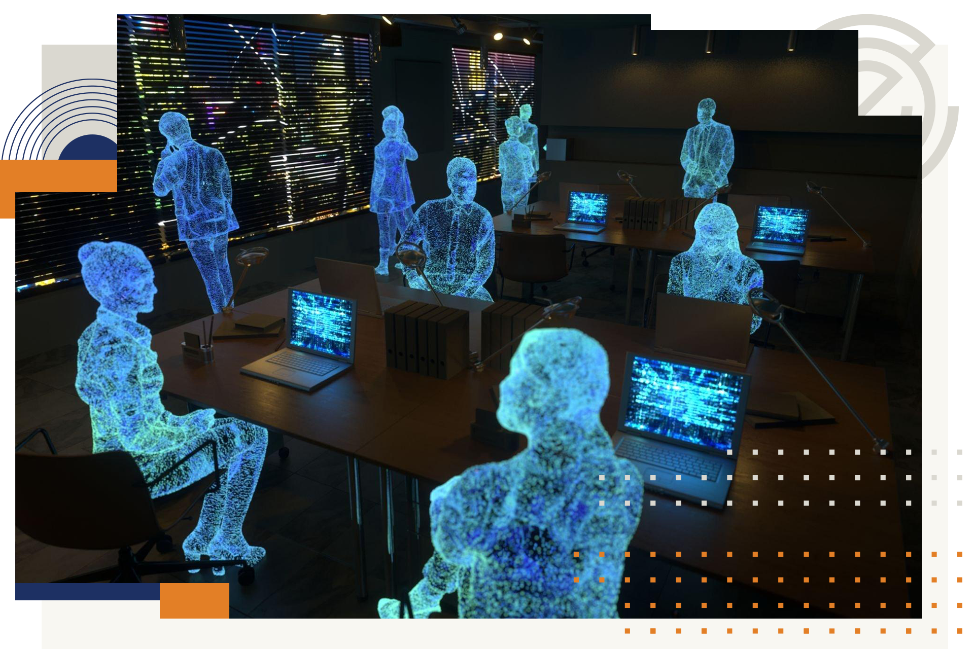 A group of people are sitting at a table with laptops.