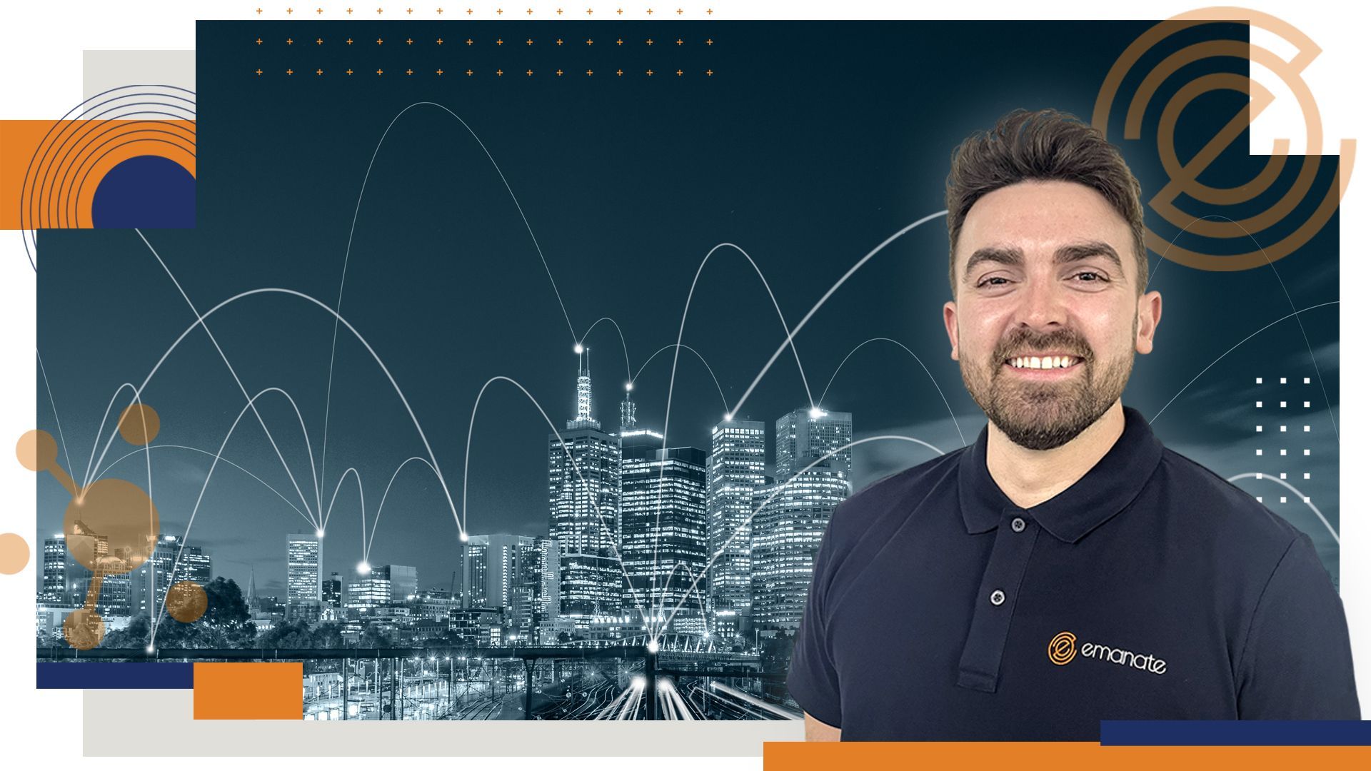 Emanate Director Jon-Paul Hoey smiling in front of a city skyline.