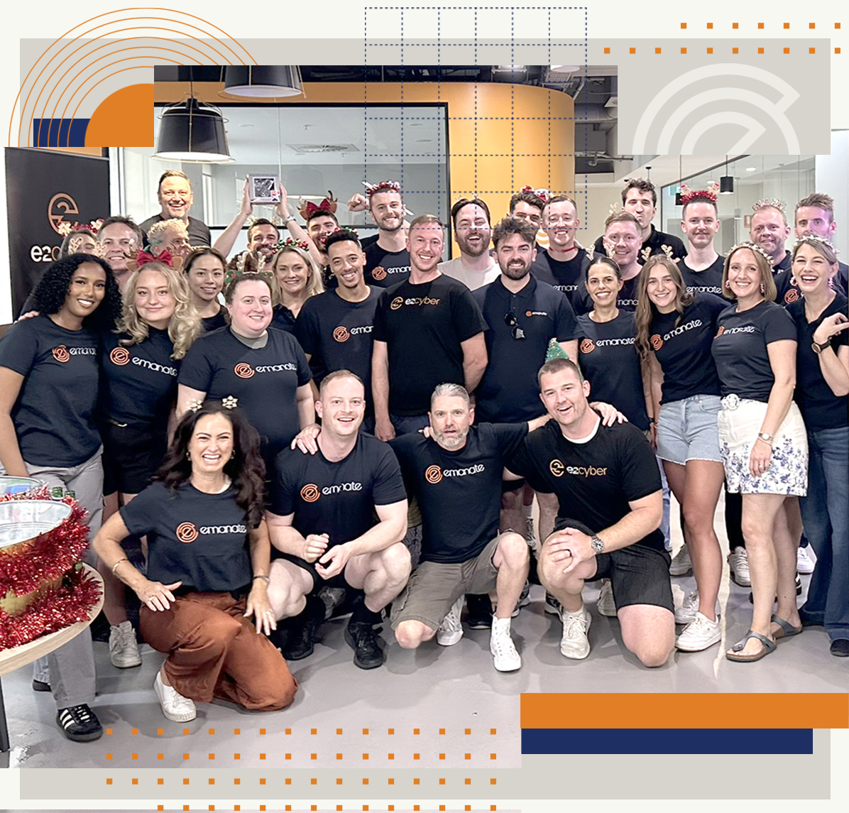 A large group of people are posing for a picture in a room.