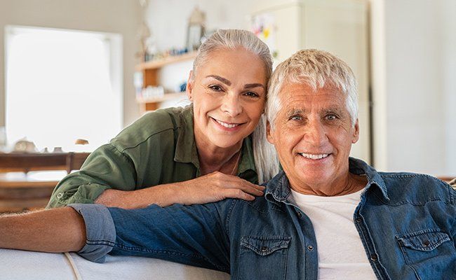 Senior couple relaxing at home — Westmont, IL — Frederic Mrugala DDS