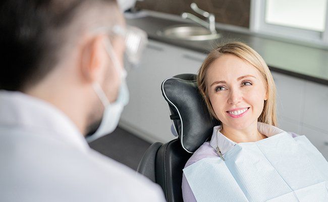 Happy young blonde female patient — Westmont, IL — Frederic Mrugala DDS