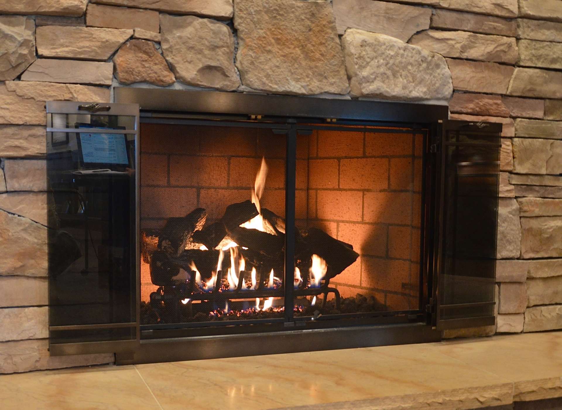 Indoor Gas Fireplace with Stone Background in Troy, NY