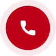 A red circle with a white phone icon inside of it.