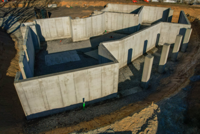 An aerial view of a concrete basement under construction.