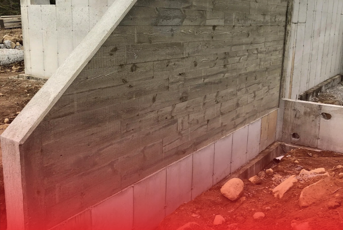 A concrete wall is being built next to a staircase.