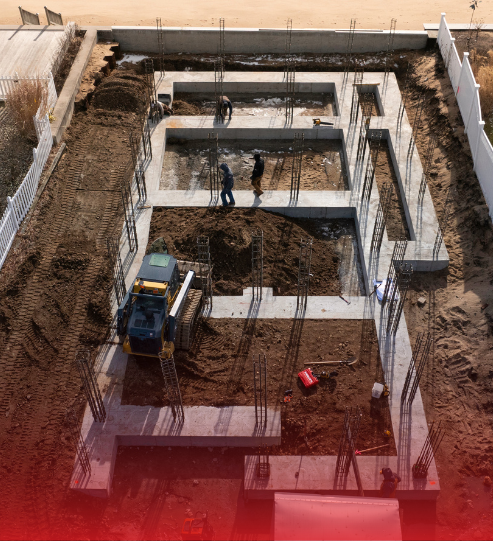 An aerial view of a construction site with a truck in the middle.
