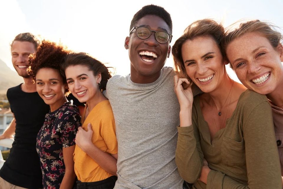 A Group of Young People Are Posing for A Picture Together and Smiling — Wonder Care Australia Pty Ltd in Kearneys Spring, QLD