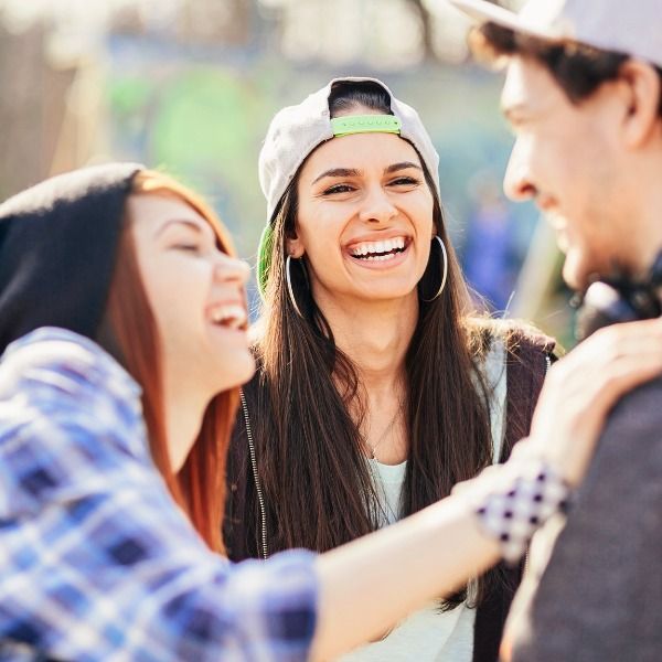 A Group of Young People Are Laughing and Hugging Each Other — Wonder Care Australia Pty Ltd in Kearneys Spring, QLD