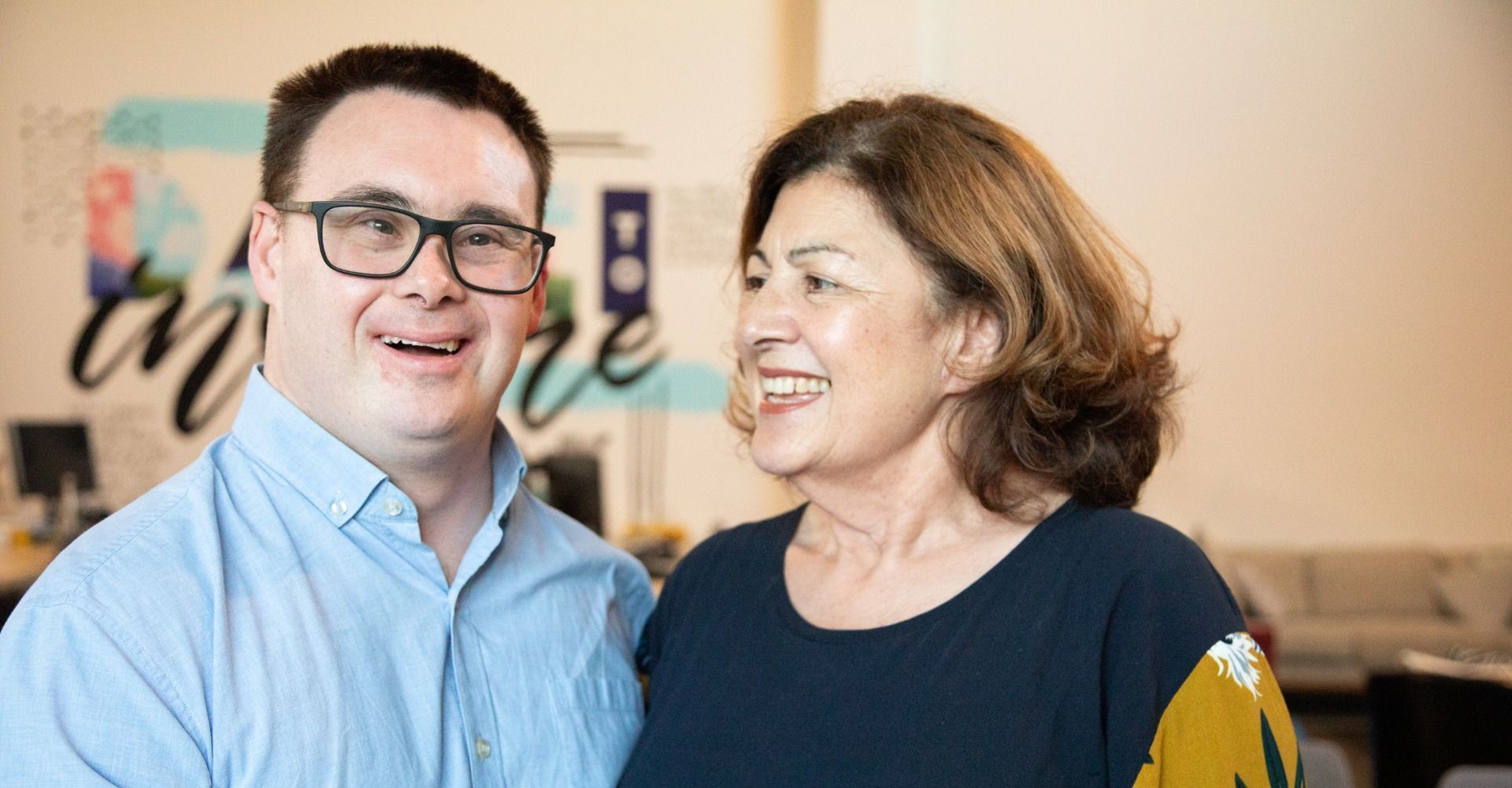 A Man and A Woman Are Standing Next to Each Other and Smiling — Wonder Care Australia Pty Ltd in Kearneys Spring, QLD