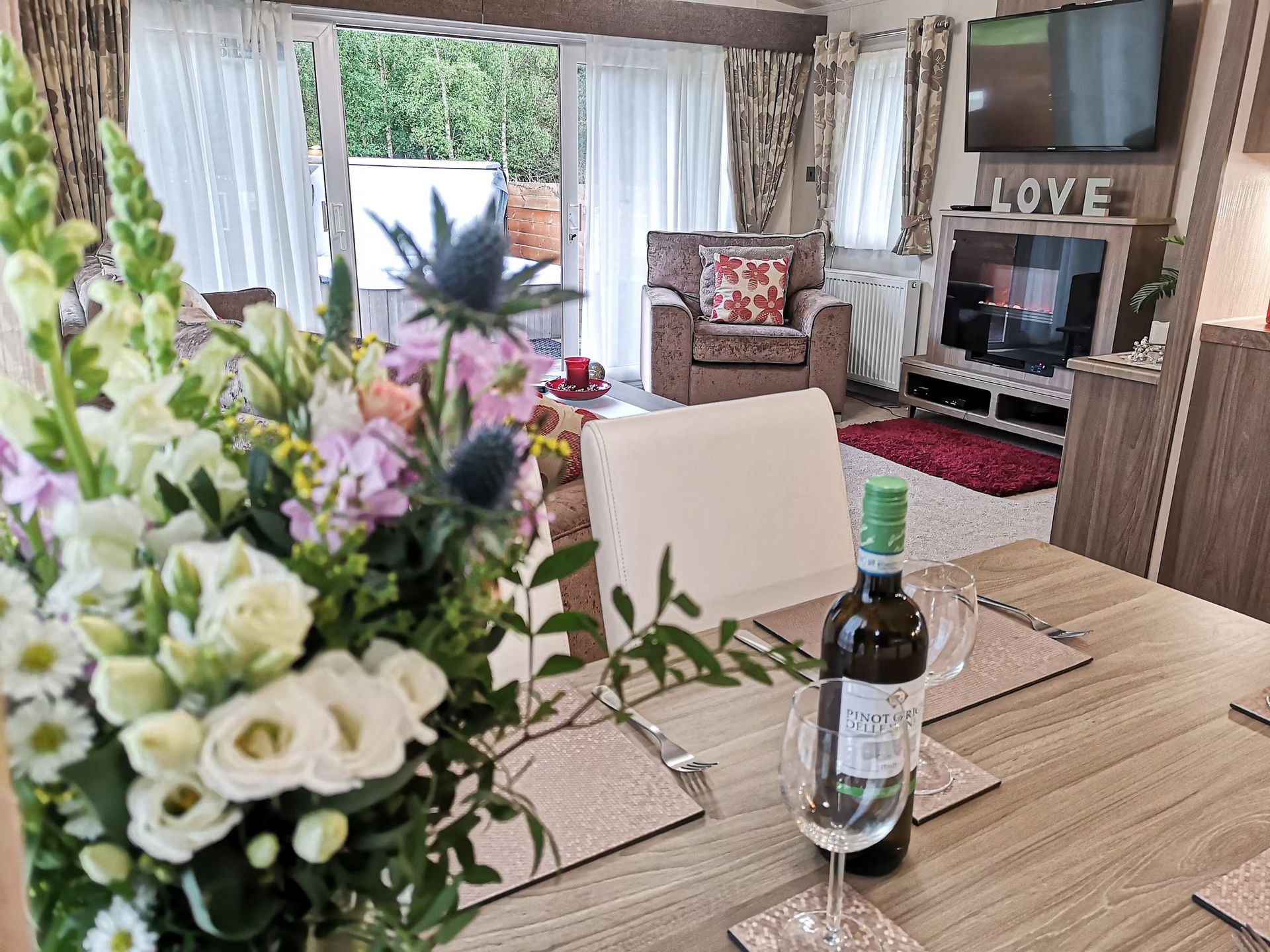 Flowers and wine on dining table
