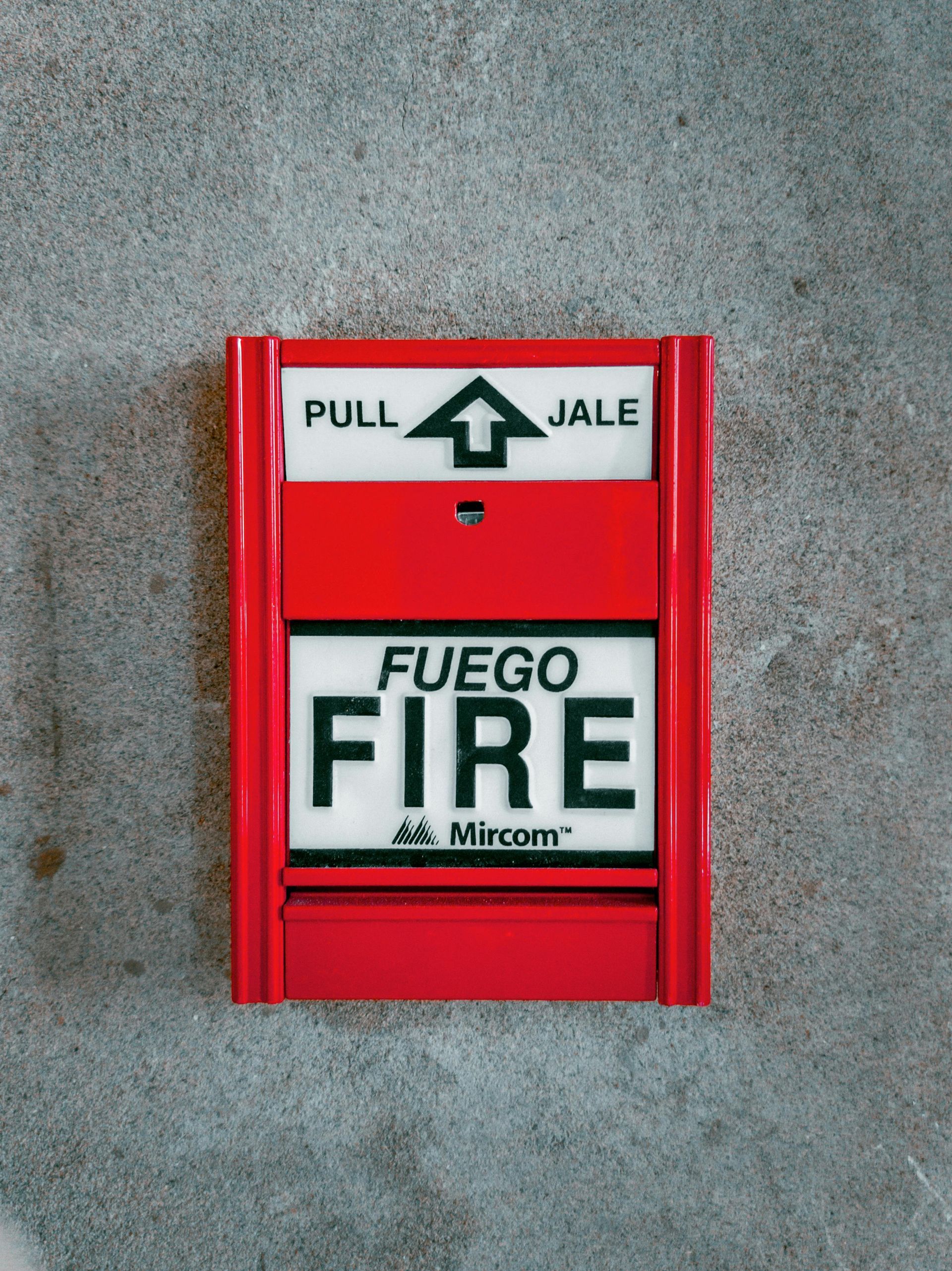 Red fire alarm box with the word 
