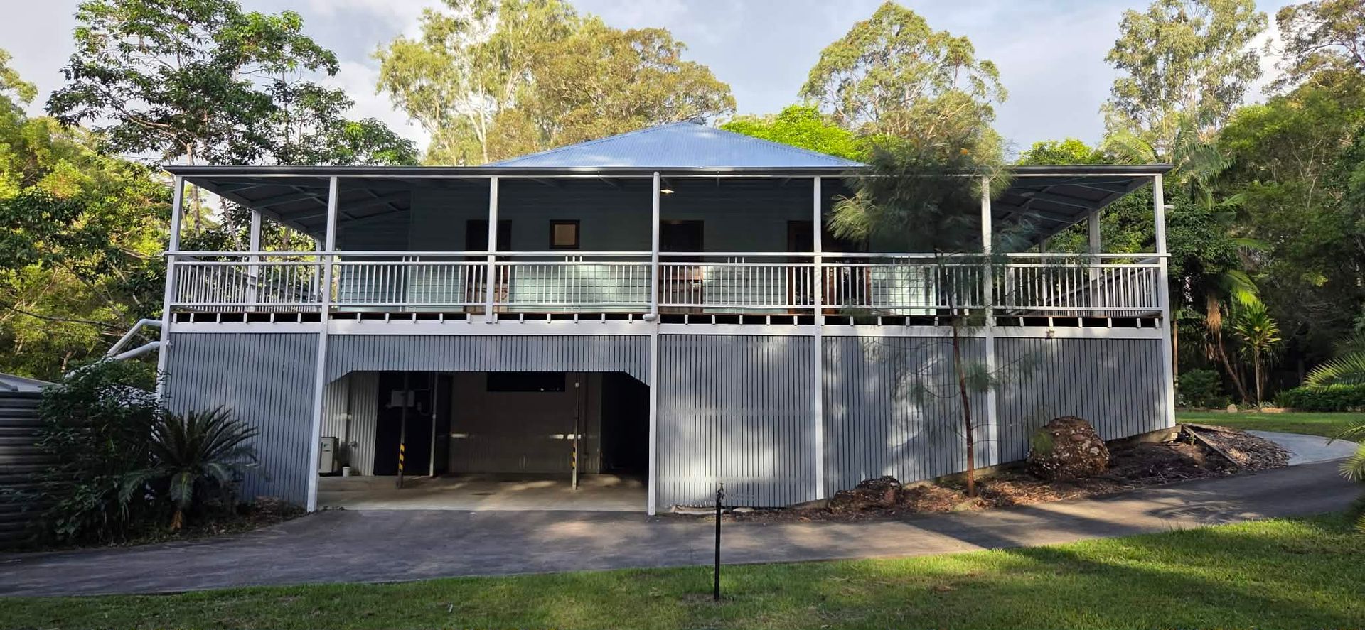 Two-story house with a balcony and a grey exterior — MVP Painting Professionals in Caloundra, QLD