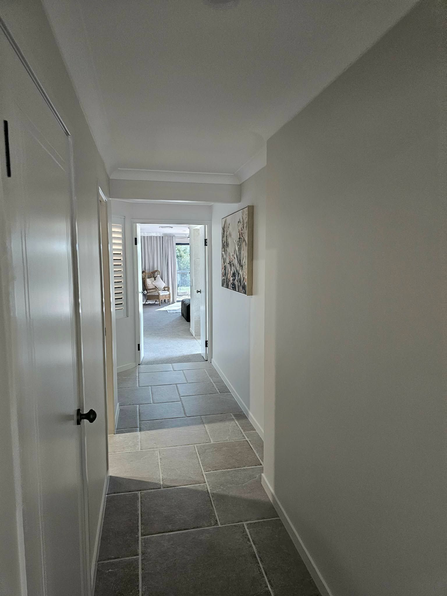 Long, narrow hallway with light gray walls — MVP Painting Professionals in Caloundra, QLD