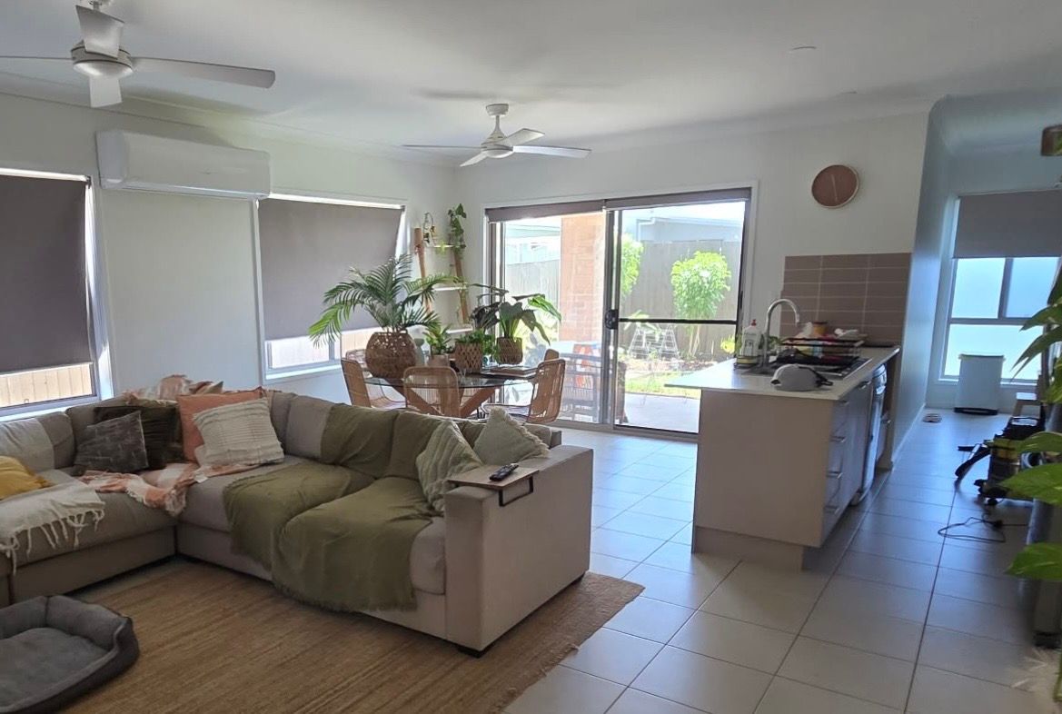 Spacious living room with sofa, dining area, and kitchen — MVP Painting Professionals in Sunshine Coast, QLD