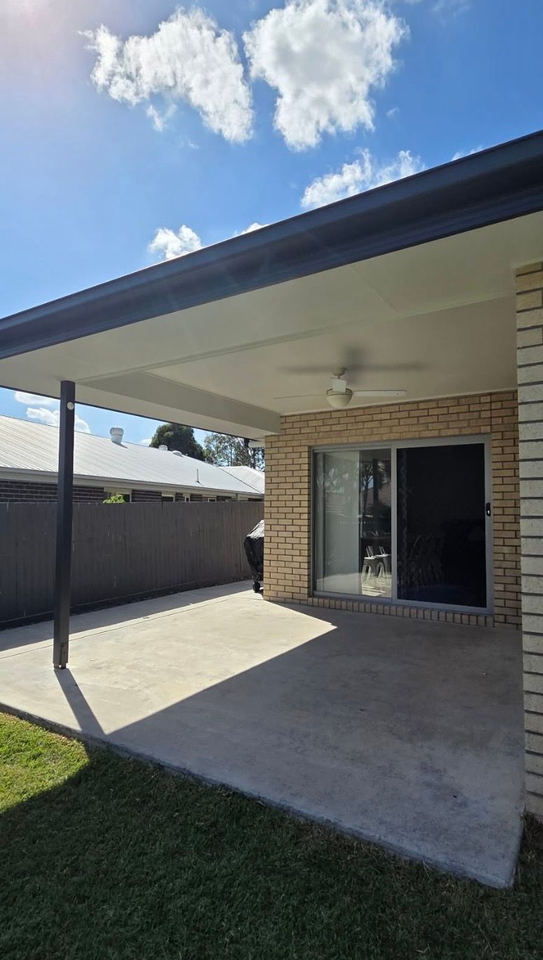 Exterior Bricked House with White Ceiling and Black Trim — MVP Painting Professionals in Landsborough, QLD