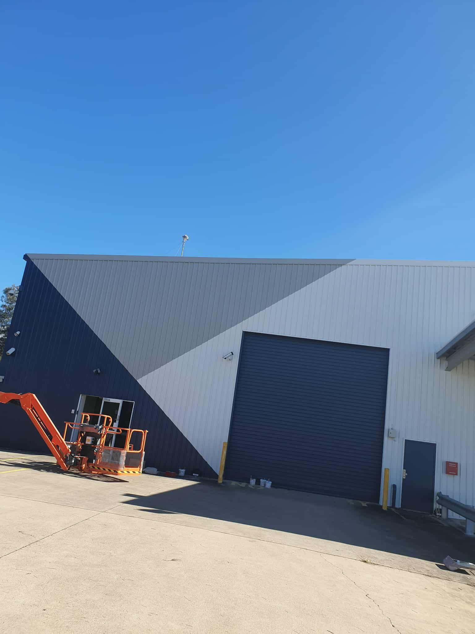 Building with geometric black and white paneling — MVP Painting Professionals in Kawana, QLD