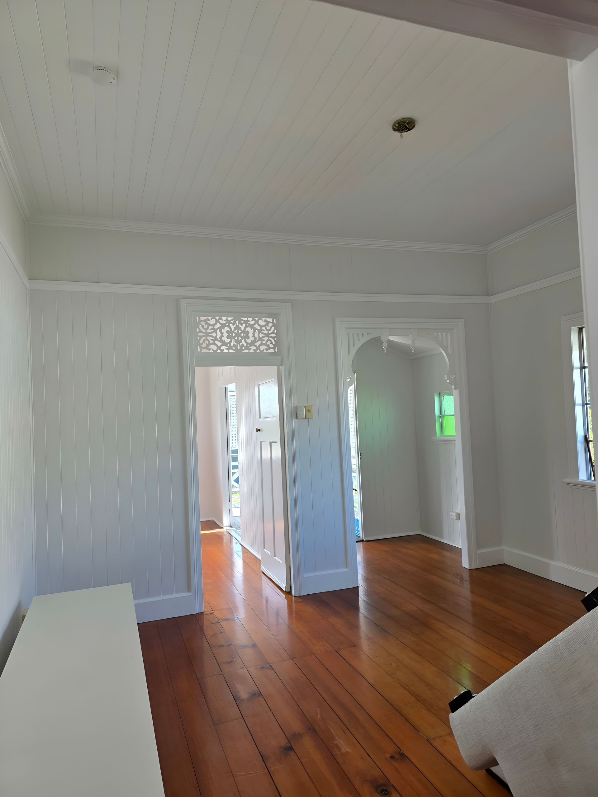 Empty White-walled Room With Wooden Floors — MVP Painting Professionals in Sunshine Coast, QLD