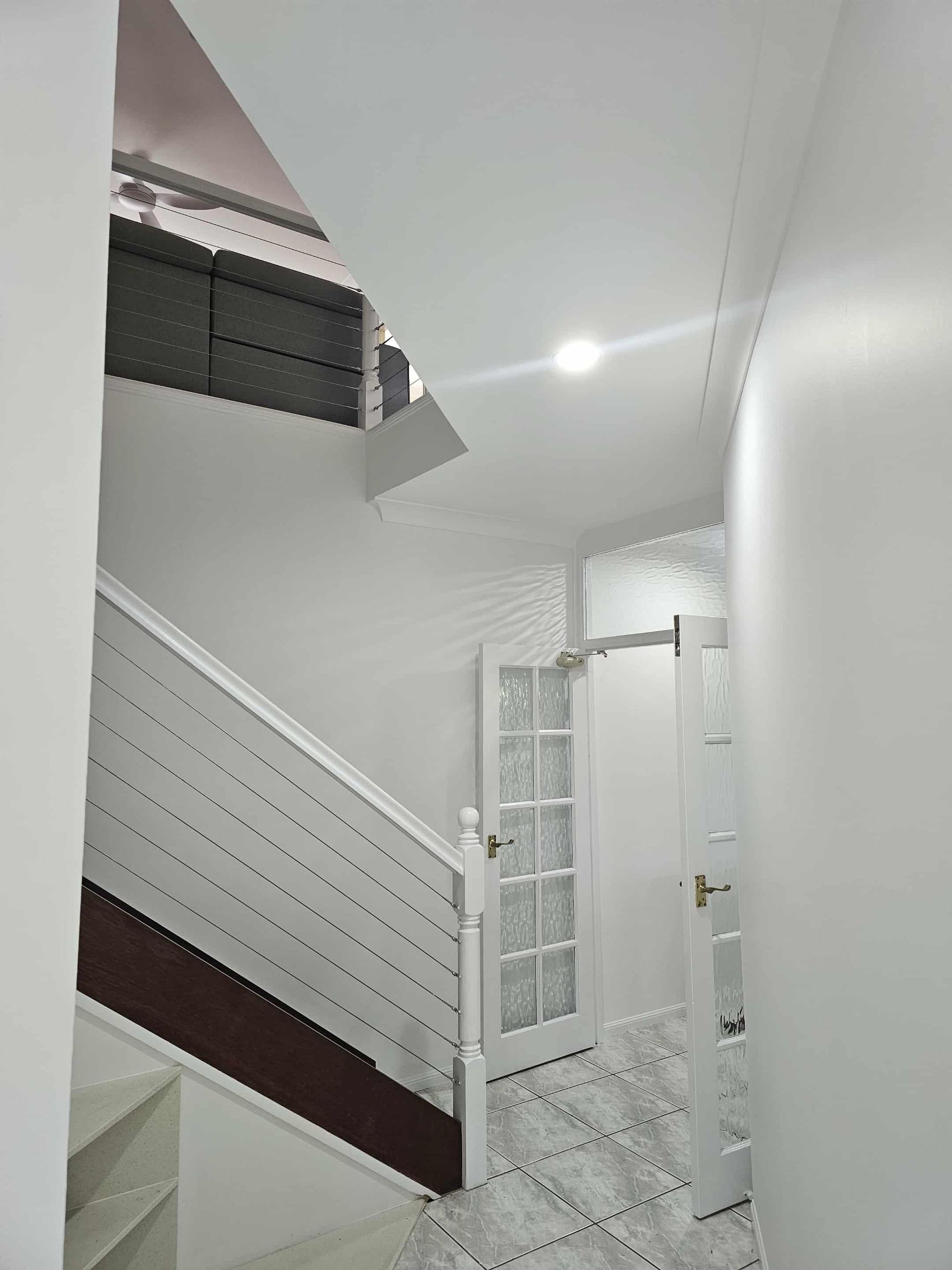 Bright, Neutral-toned Interior With Winding Staircase— MVP Painting Professionals in Landsborough, QLD