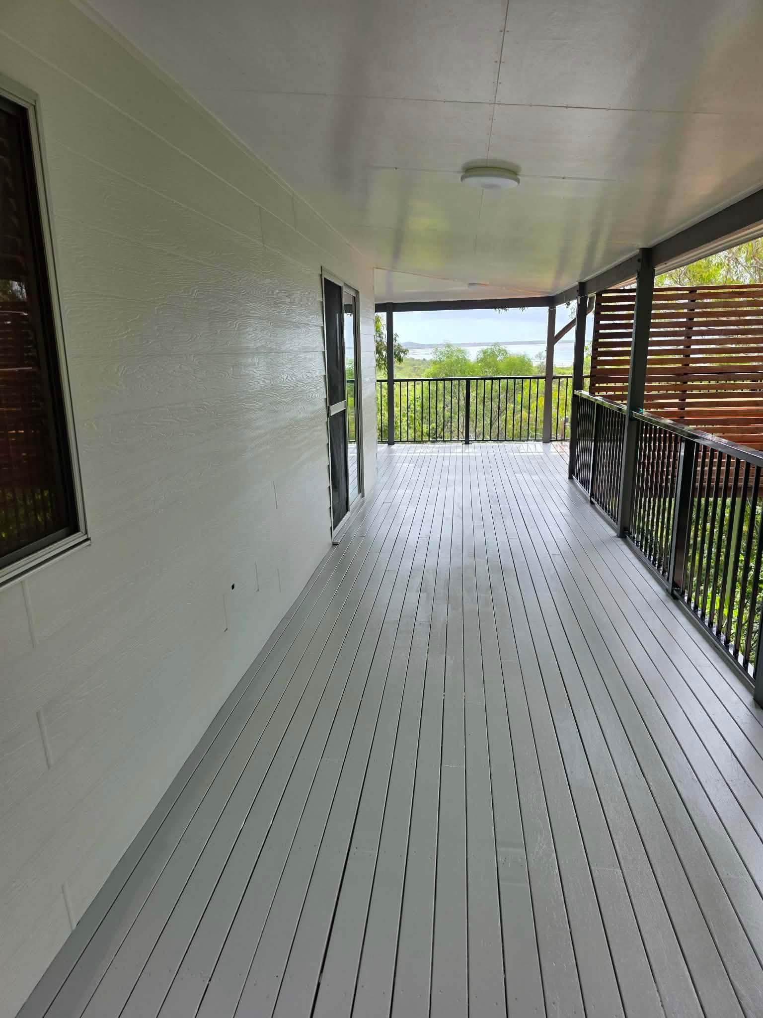 Outside Deck With Grey Walls,and Black Railing — MVP Painting Professionals in Sunshine Coast, QLD