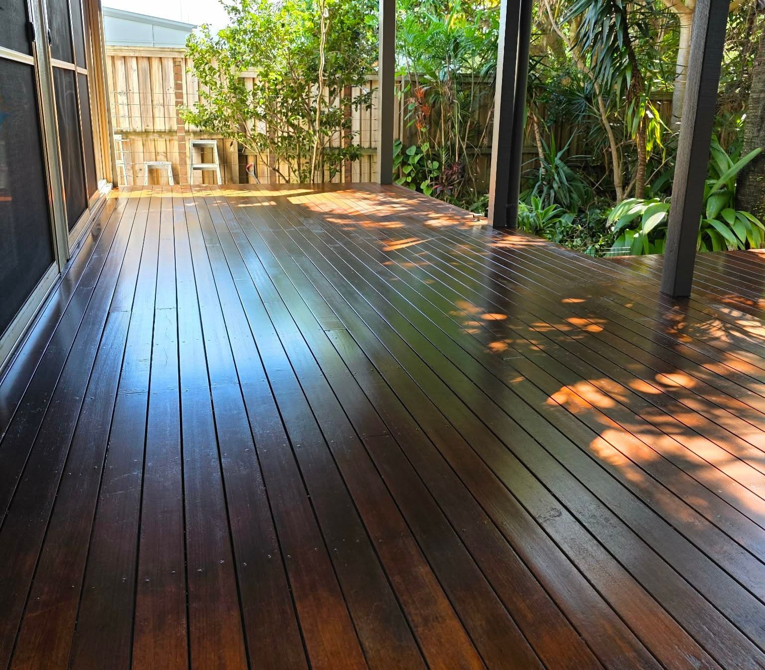 Timber Deck Flooring with Green Plants — MVP Painting Professionals in Caloundra, QLD 