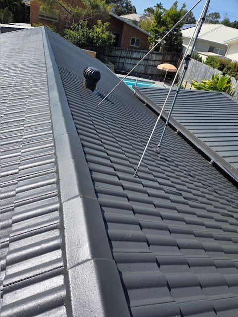Dark gray tiled roof with a black trim and a vent — MVP Painting Professionals in Noosa, QLD