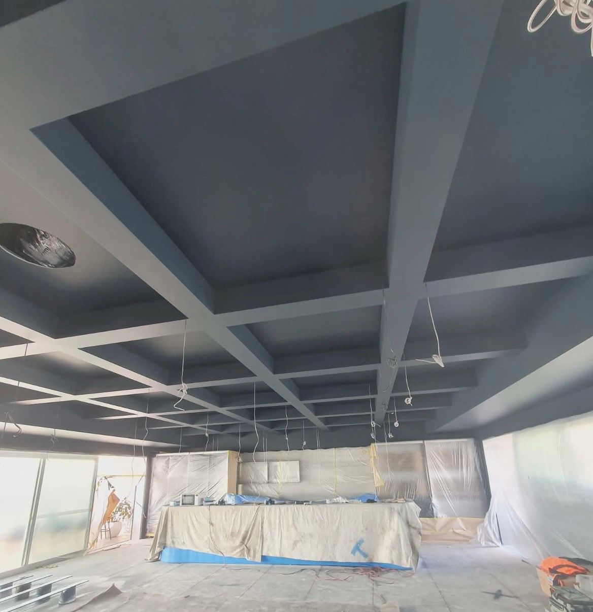 Blue painted ceiling with recessed grid, bar area, windows, construction — MVP Painting Professionals in Noosa, QLD