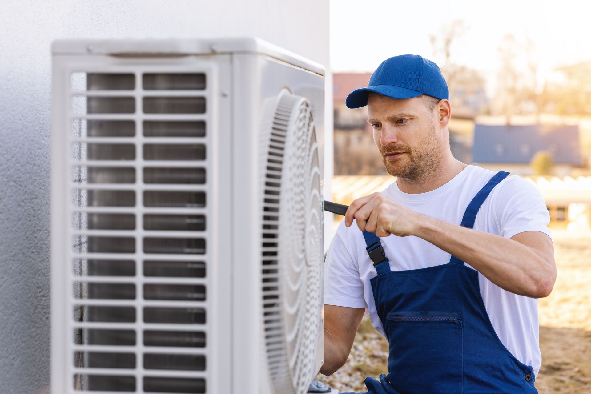 A modern heat pump installed outside a Ridgeland home during winter.