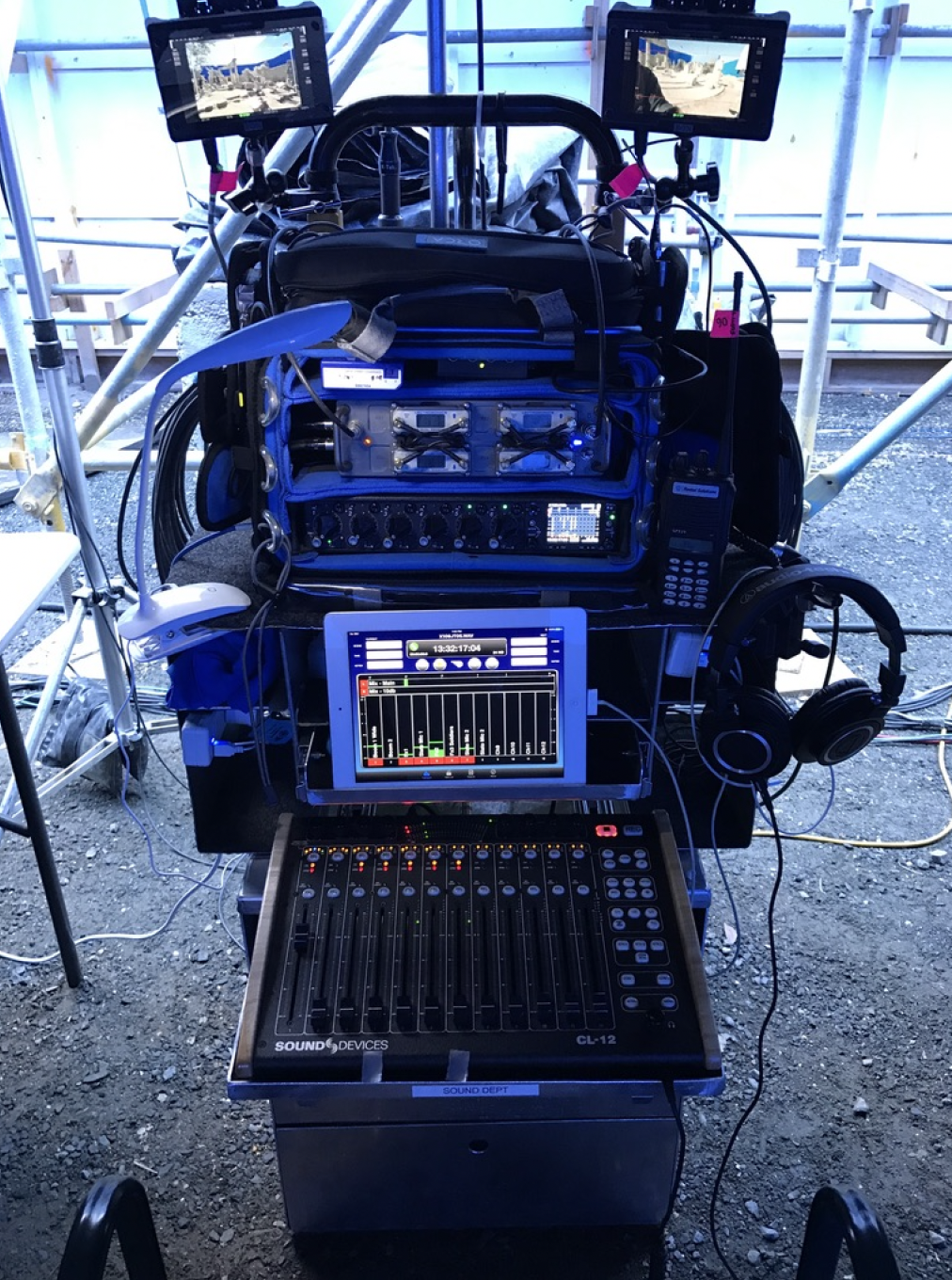 A mixer with a tablet and headphones on top of it