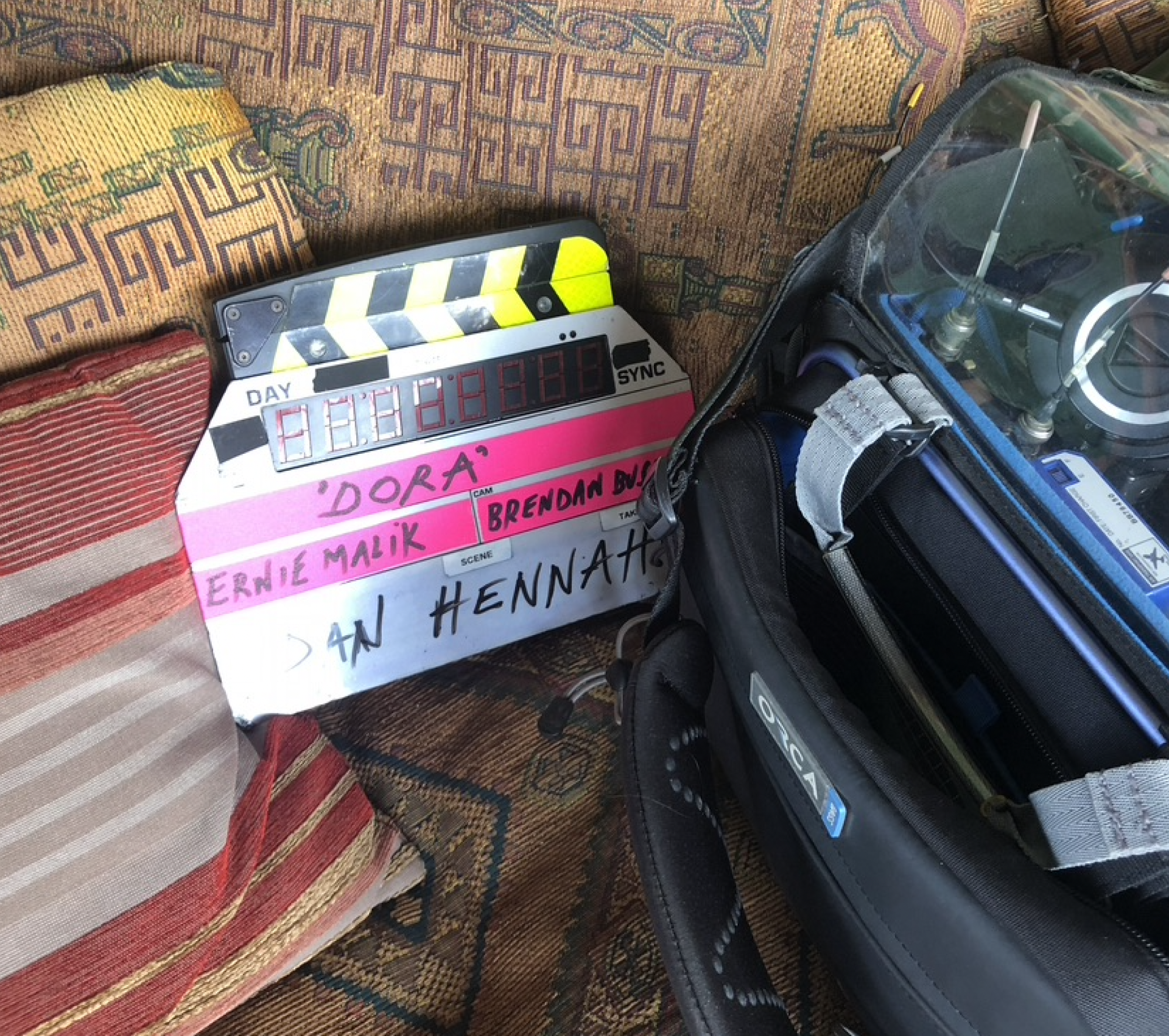 A clapper board with the name dora written on it