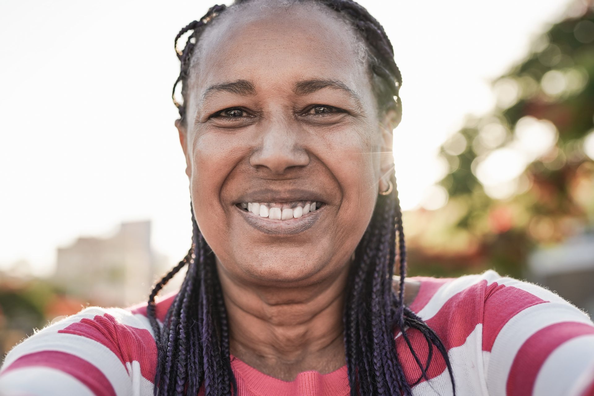 A woman feeling excited after working through self-esteem issues 