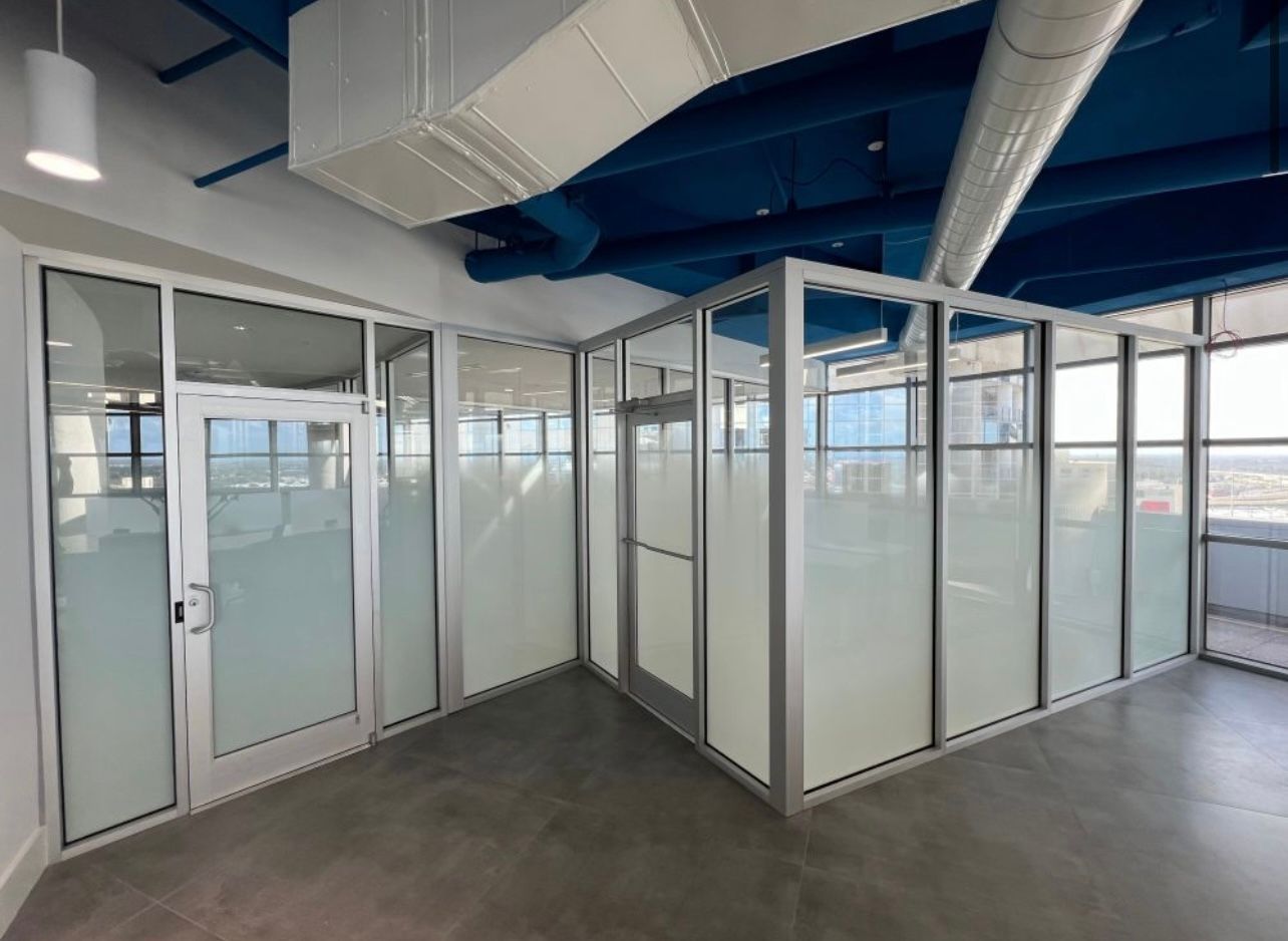 A room with a lot of windows and a blue ceiling.