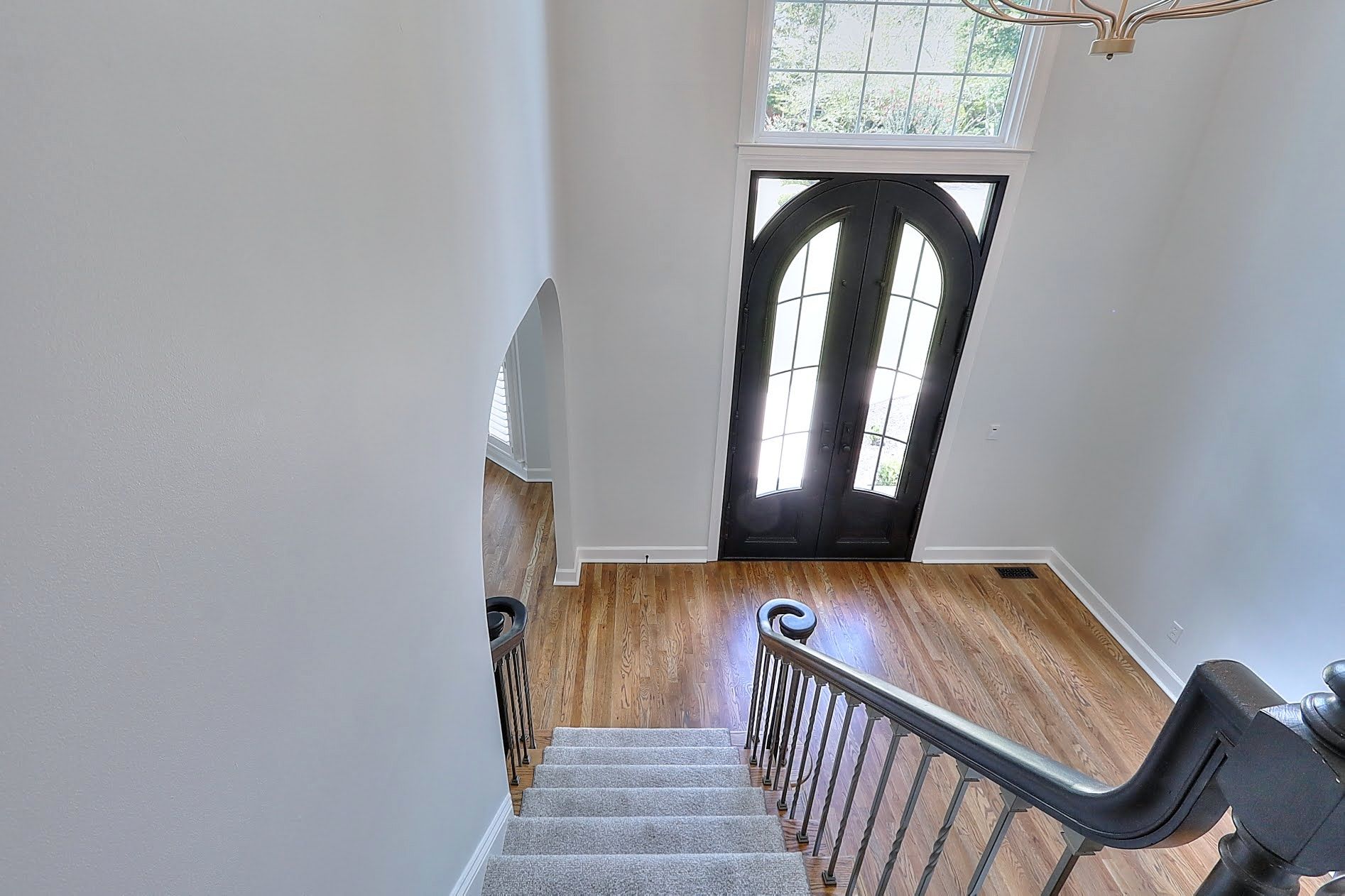 A staircase leading up to a door in a house