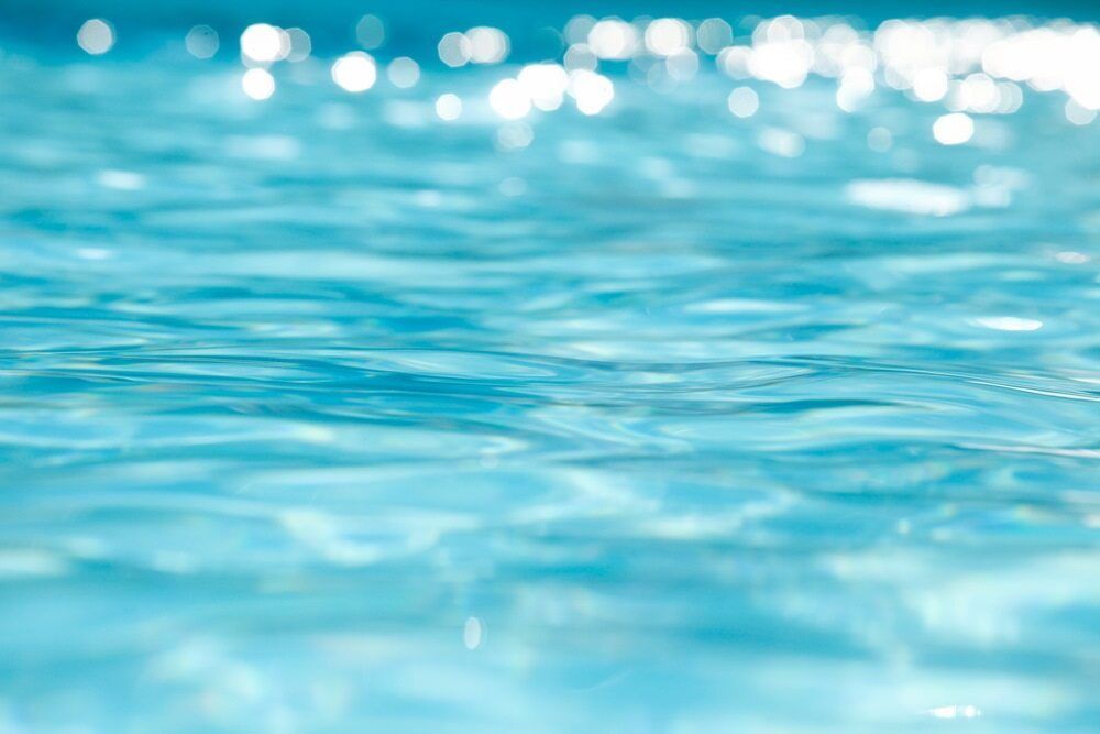 Azure Water Surface With Light Reflecting, Creating Soft Patterns and Highlights — Dean Thomas Pools in Tablelands, QLD