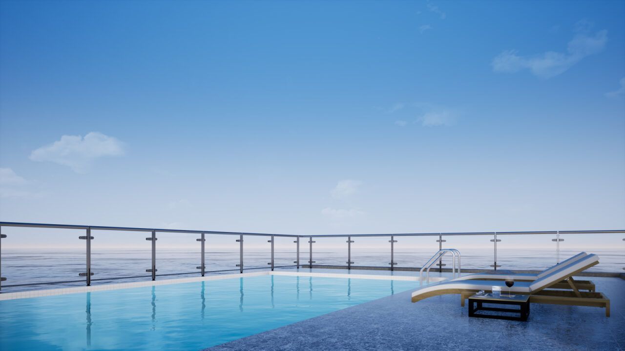 Poolside With Ocean View, Blue Sky, Lounge Chair — Dean Thomas Pools in Manunda, QLD