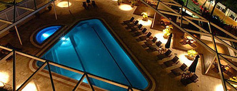 Night View of a Pool With an Adjacent Hot Tub — Dean Thomas Pools in Manunda, QLD